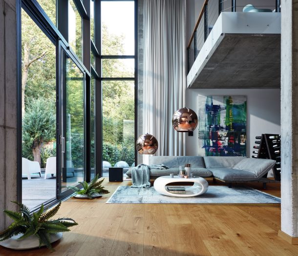 Woonkamer in industriele stijl met hoge ramen, hoekbank en Meister houten vloer